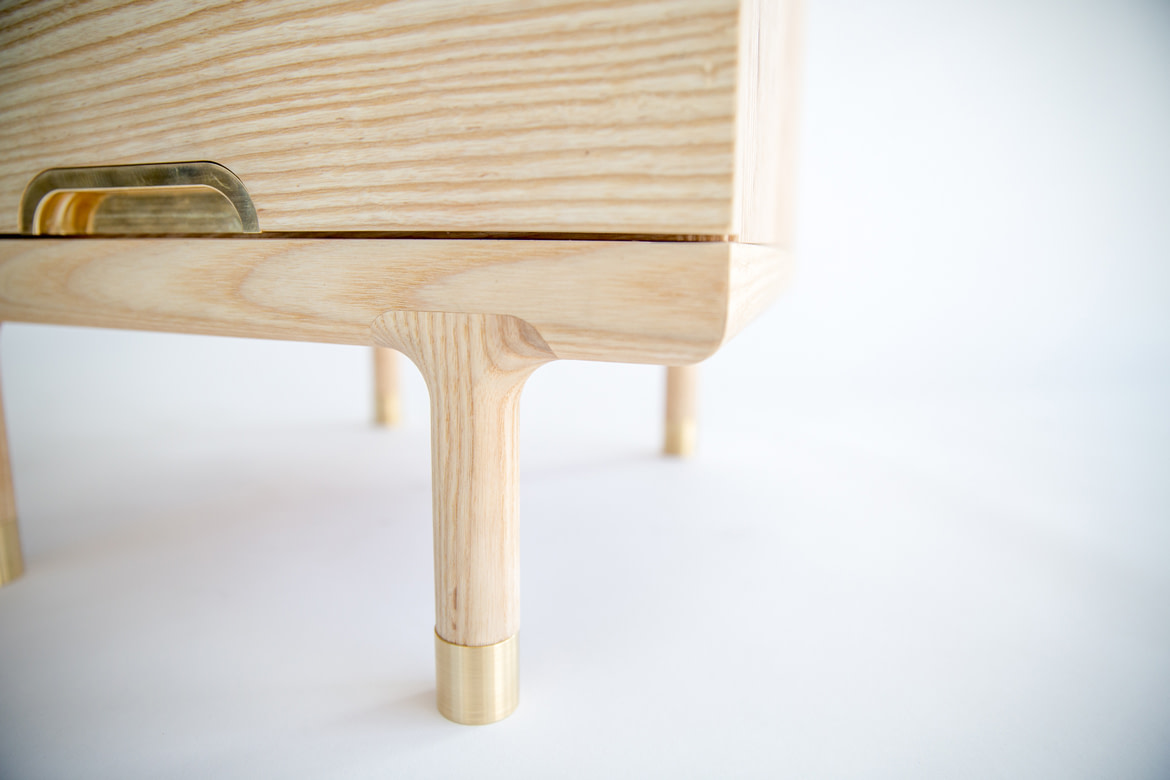 simple side table with brass foot detail