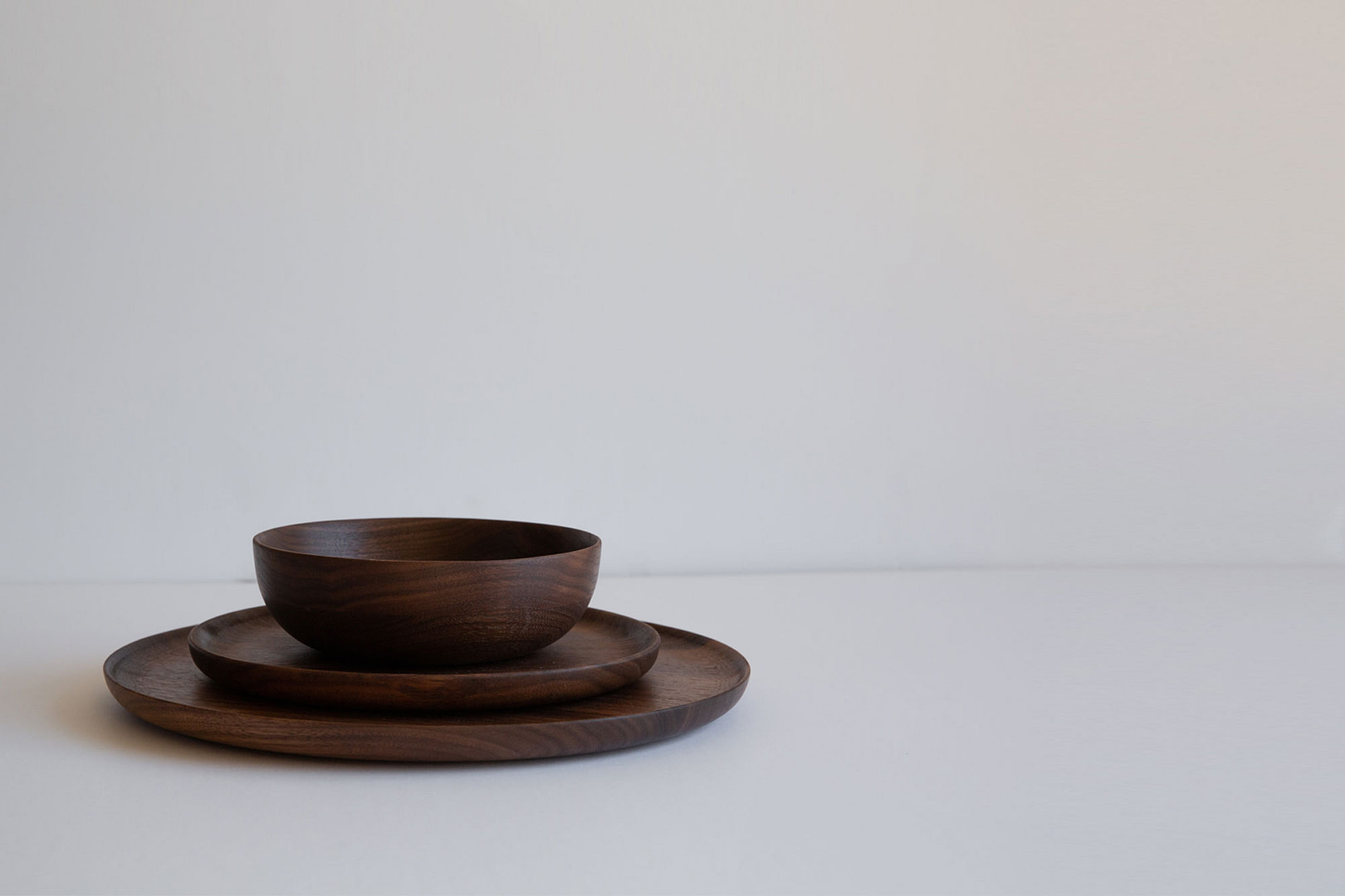3 piece set walnut fullbleed Roasted 3 piece Set Stacked a Dark Bowl on the 85 inch and 11 inch Plates Empty on White
