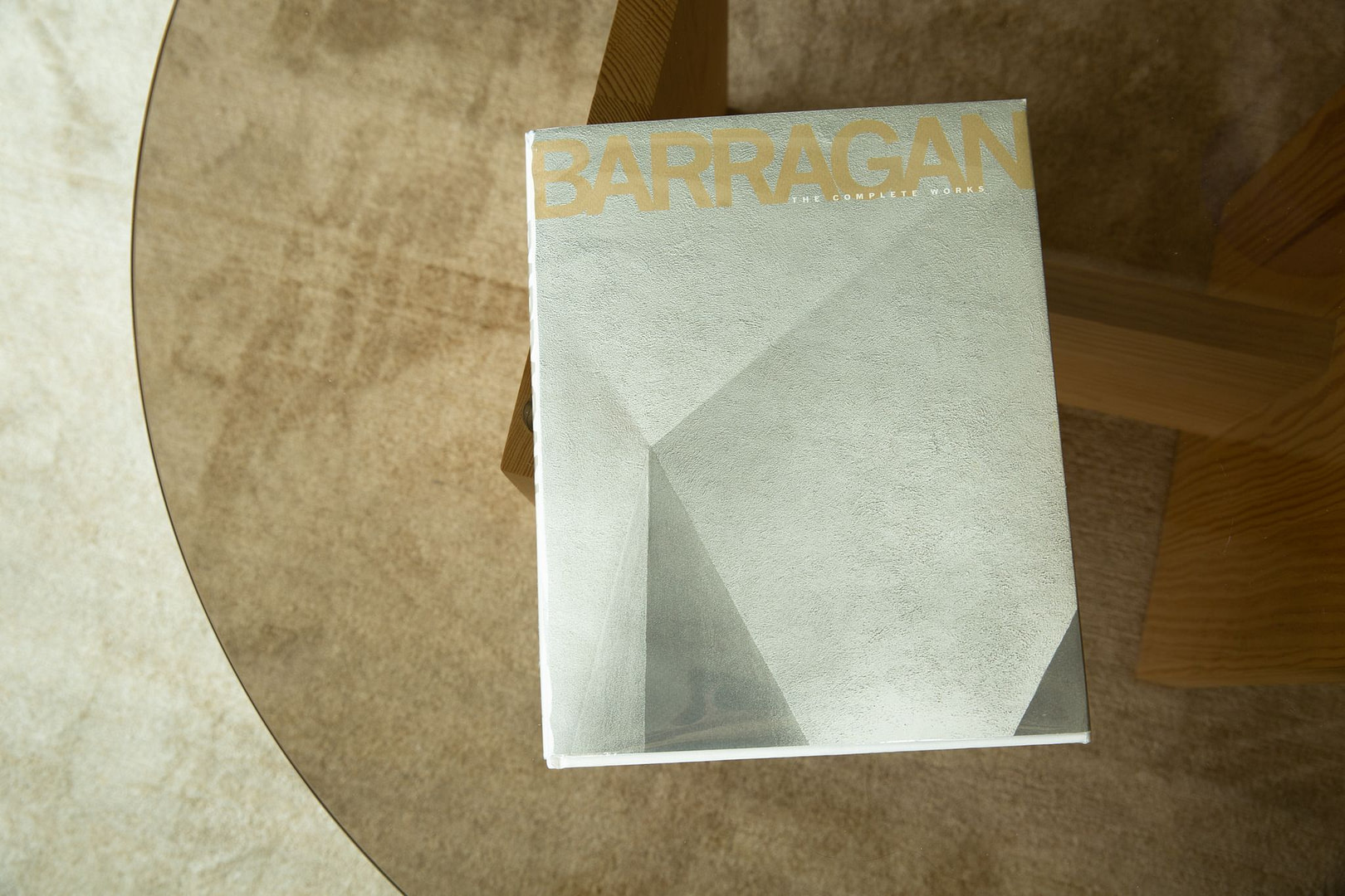 Thekalonlibrary barragan Close up of a Book Cover Reading barragan with Small the Complete Works Text Resting on a Wooden Table Edge