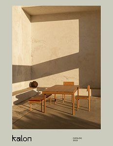 Wooden Dining Table with Three Chairs in a Sunlit Minimalist Courtyard Long Geometric Shadows on Beige Walls and a Clay Pot Nearby |  | Kalon Studios Us